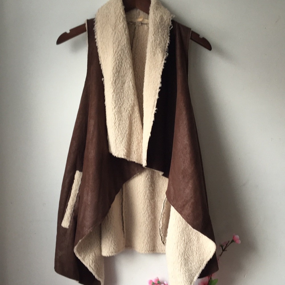 A faux shearling asymmetrical vest